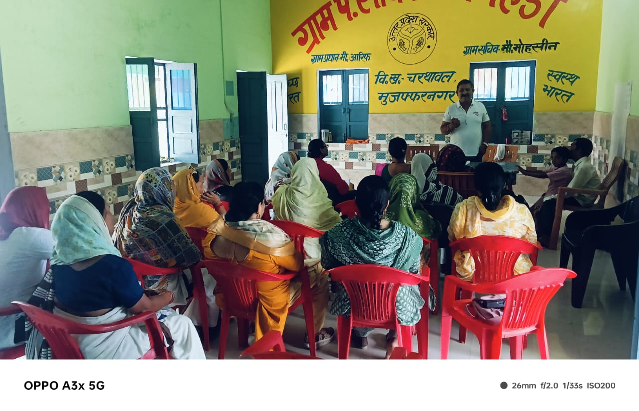 A community gathering with a speaker addressing participants